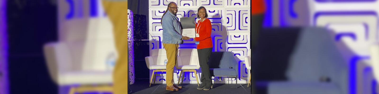 An award presentation on stage